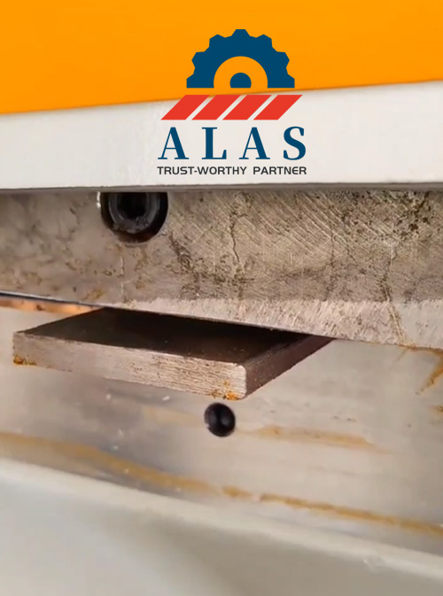 Hydraulic ironworker flat bar shear blade in operation cutting a thick metal plate