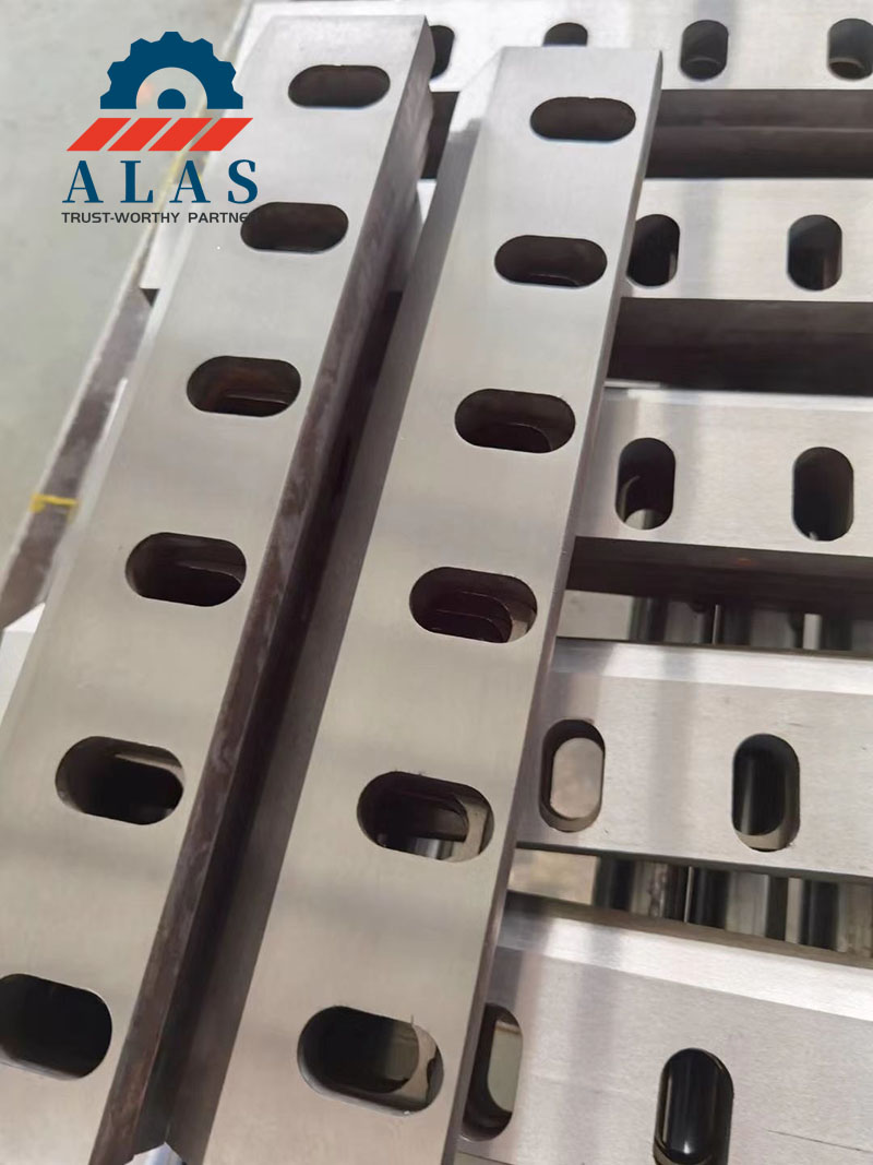 Precision-ground plastic shredder blades with heavy-duty bolt slots