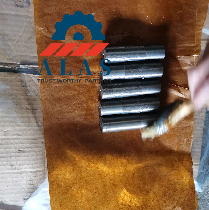 Factory specialist applying professional anti-rust oil coating on premium replacement rebar bender pins
