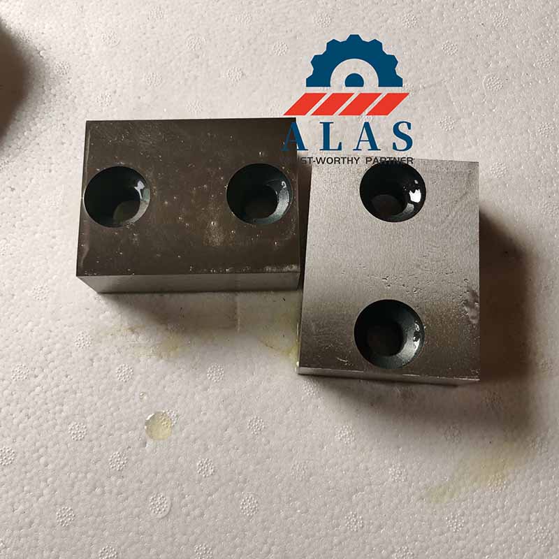 Ground and treated two-hole rectangular manual bar cutter blades displaying ground contact faces and solid forging profiles built to prevent shear plane fracturing