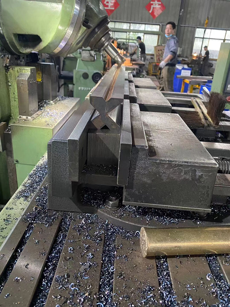 Precision CNC Machining for Press Brake Tooling | ALAS Factory CNC milling machine processing the V groove of a heavy duty press brake die in workshop