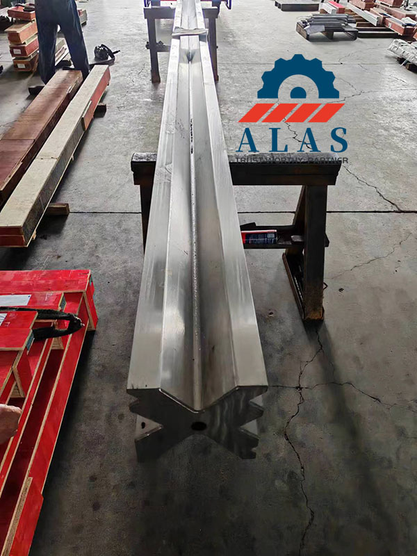 Ultra-long single-piece monoblock 4-way bottom die aligned on workshop bench