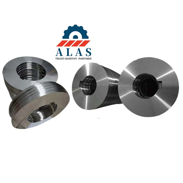 A collection of custom multi-size alloy steel circular slitting knives with clear drive slots and keyways.