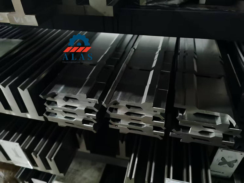 Close up view of precision ground segmented press brake punches with tight tolerances