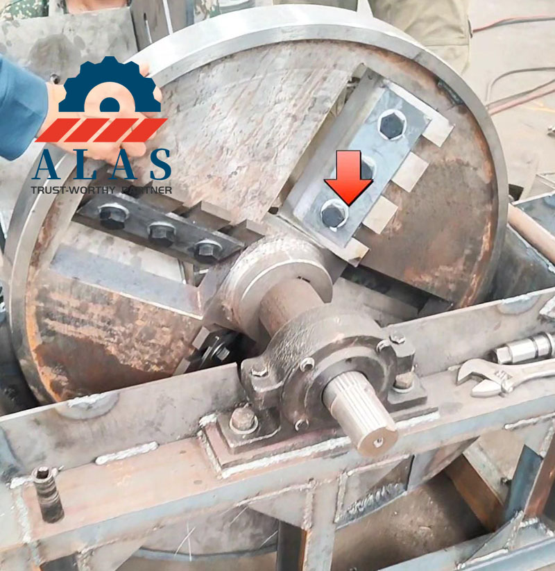 Precision installation of replacement rotating cutting blades on a wood chipper disc cutter head assembly