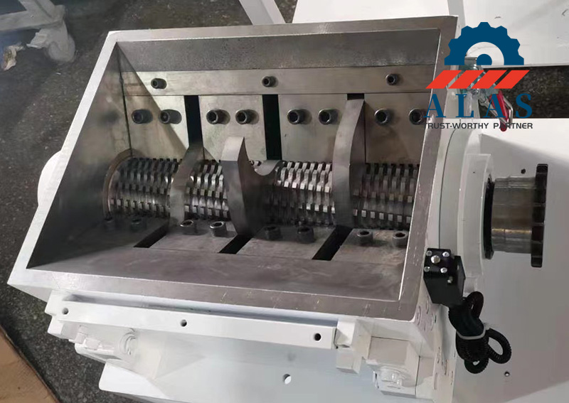 Internal view of ALAS plastic granulator cutting chamber showcasing staggered claw rotor blades and stationary bed knives assembly